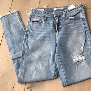 721 High-rise skinny light wash ripped jeans